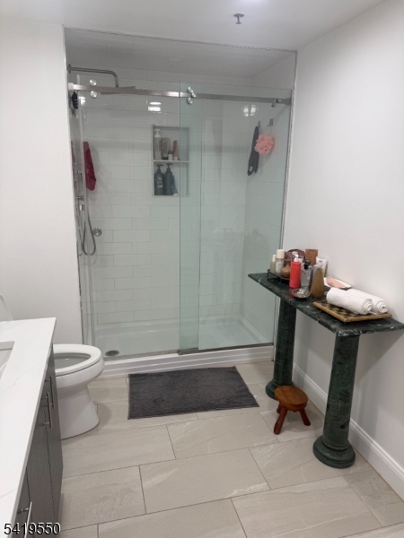 350 Scotland Road, Unit 105 Orange, NJ 07050 - Photo 9 of 17 a bathroom with a sink toilet and shower