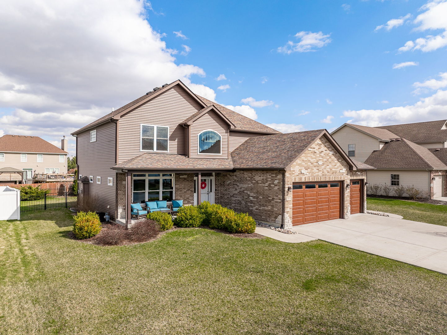 311 West Frontier Drive Minooka, IL 60447 - Photo 1 of 44 a view of a house with a yard and plants
