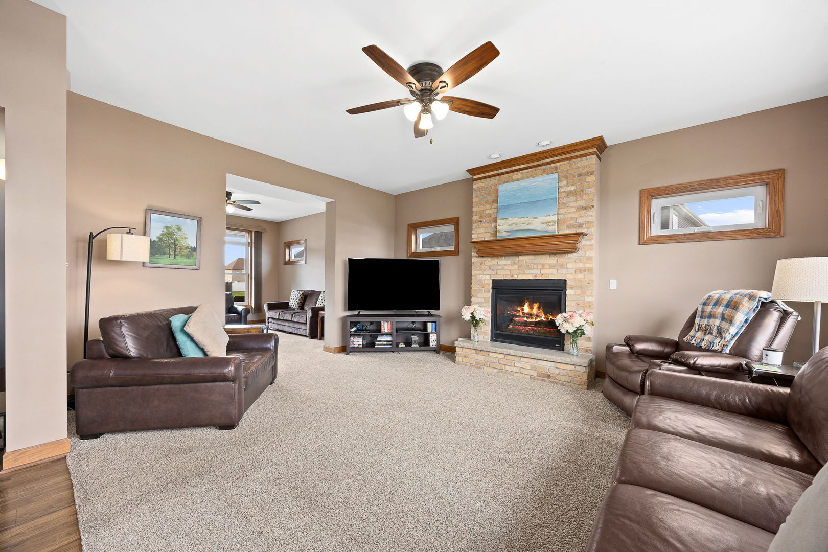 311 West Frontier Drive Minooka, IL 60447 - Photo 15 of 44 a living room with furniture and a flat screen tv