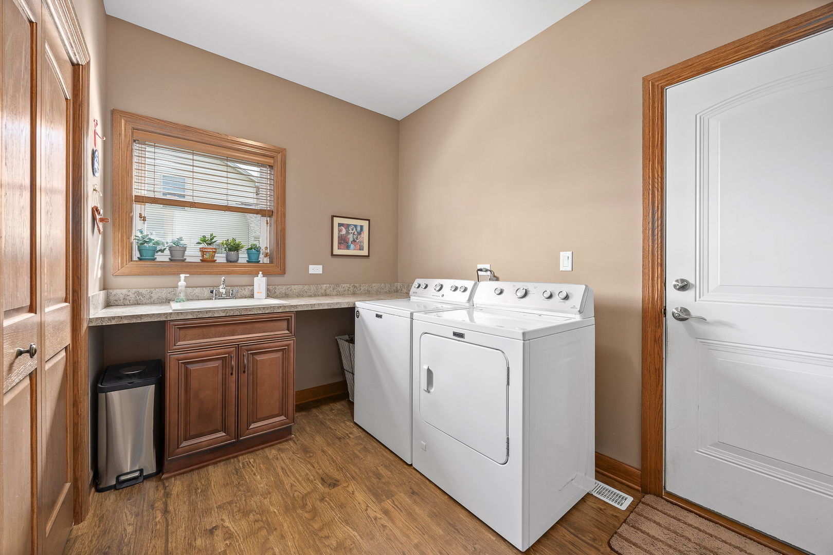 311 West Frontier Drive Minooka, IL 60447 - Photo 16 of 44 a utility room with sink dryer and washer