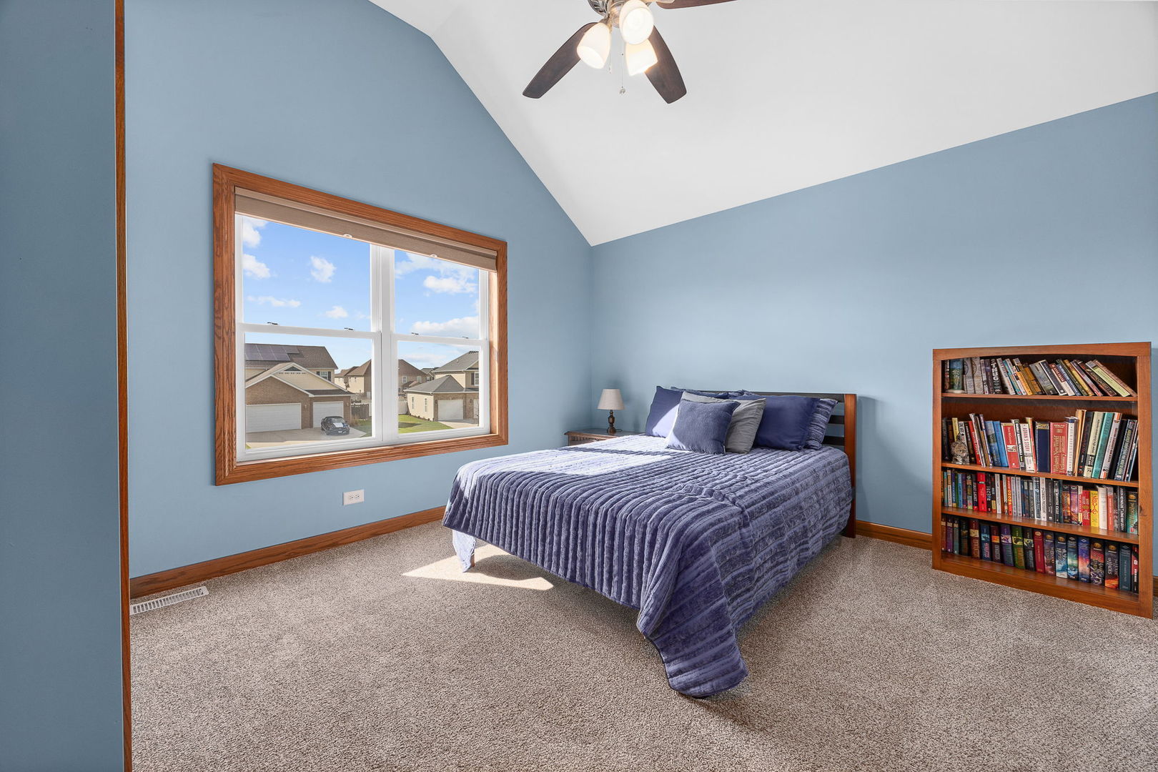 311 West Frontier Drive Minooka, IL 60447 - Photo 24 of 44 a spacious bedroom with a large bed and a window