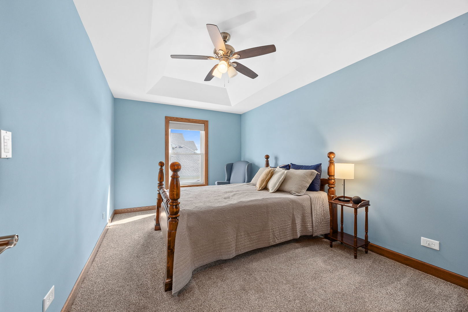 311 West Frontier Drive Minooka, IL 60447 - Photo 25 of 44 a bedroom with a bed and a chandelier