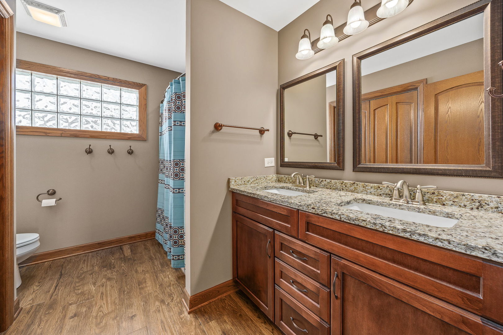 311 West Frontier Drive Minooka, IL 60447 - Photo 26 of 44 a bathroom with a granite countertop sink and a mirror