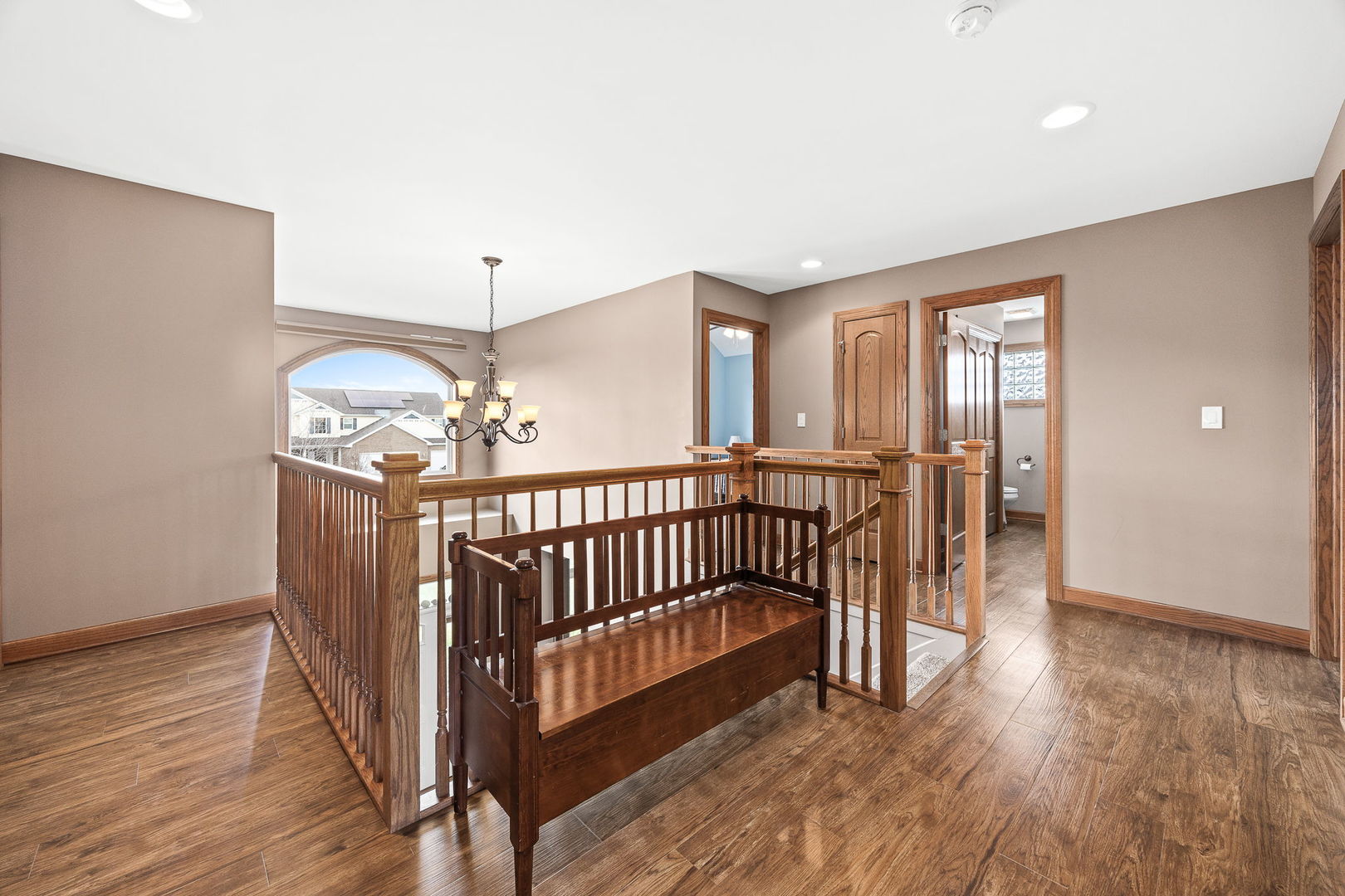 311 West Frontier Drive Minooka, IL 60447 - Photo 27 of 44 a view of a hallway with dining room and wooden floor