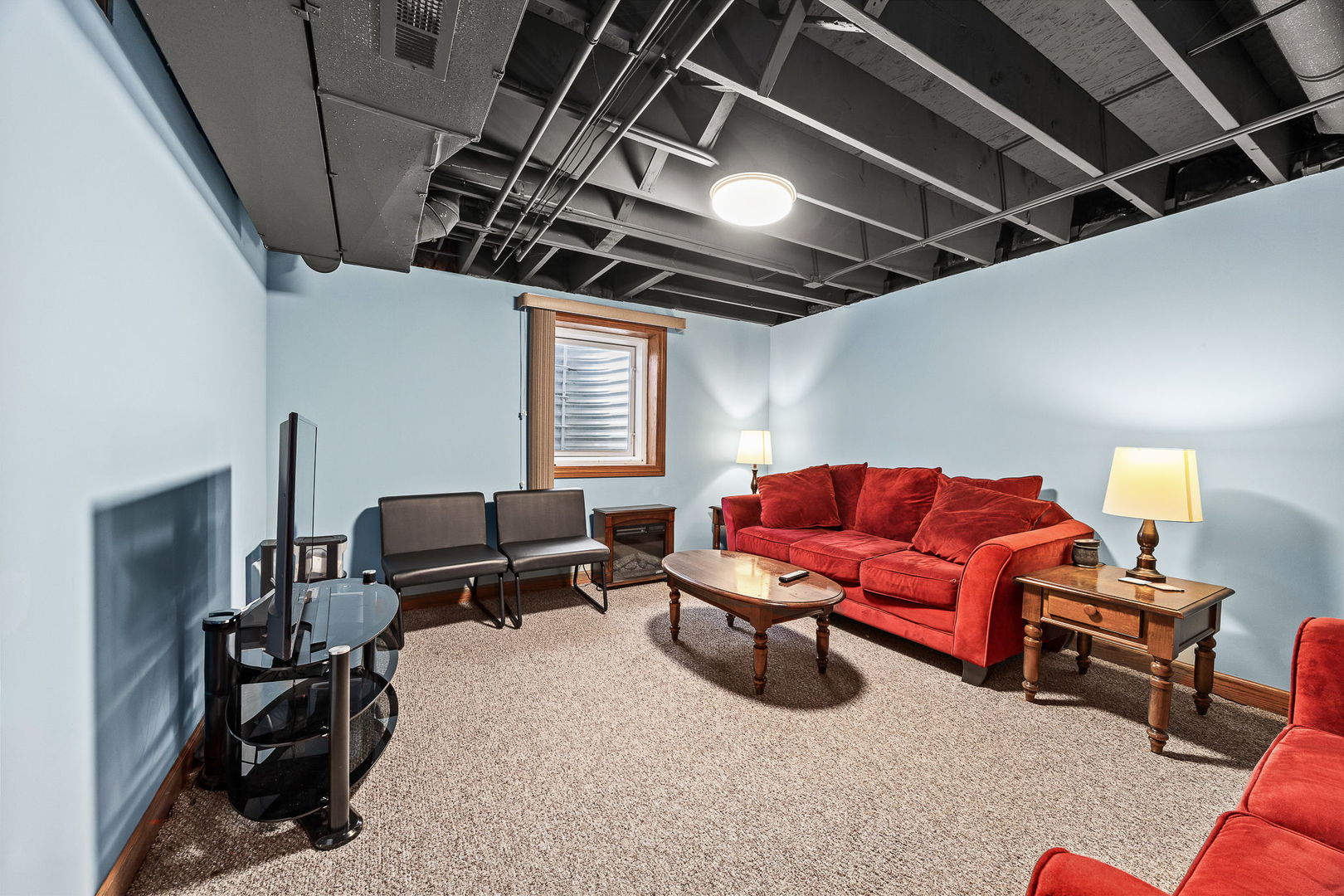 311 West Frontier Drive Minooka, IL 60447 - Photo 28 of 44 a living room with furniture a air conditioner vent and a window