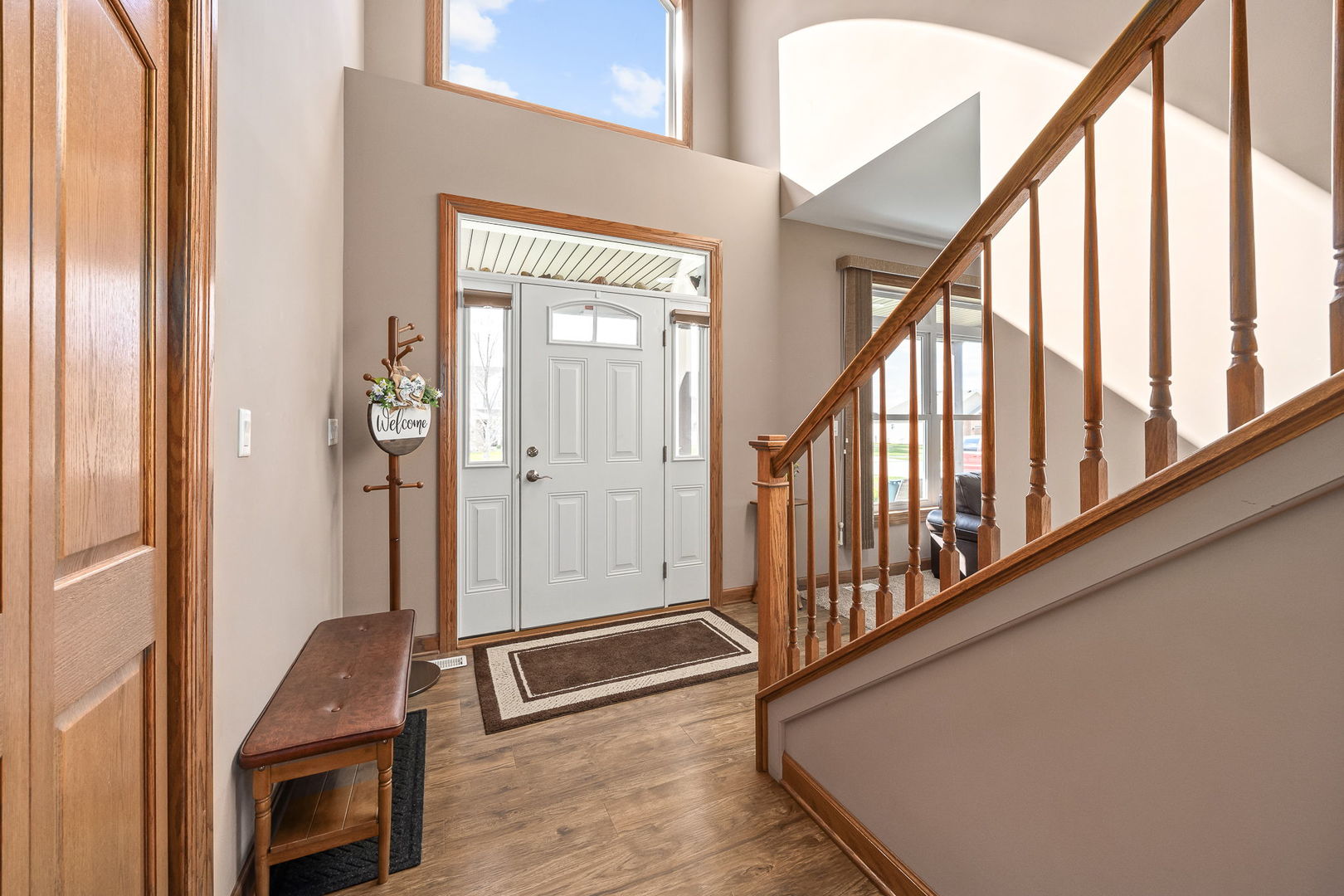 311 West Frontier Drive Minooka, IL 60447 - Photo 3 of 44 a view of an entryway with wooden floor and door