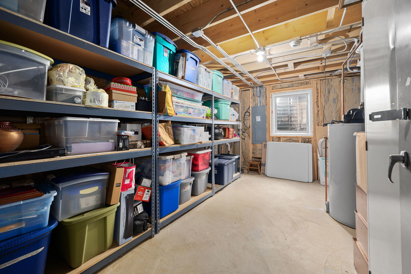 311 West Frontier Drive Minooka, IL 60447 - Photo 31 of 44 a view of a storage and utility room with washer and dryer