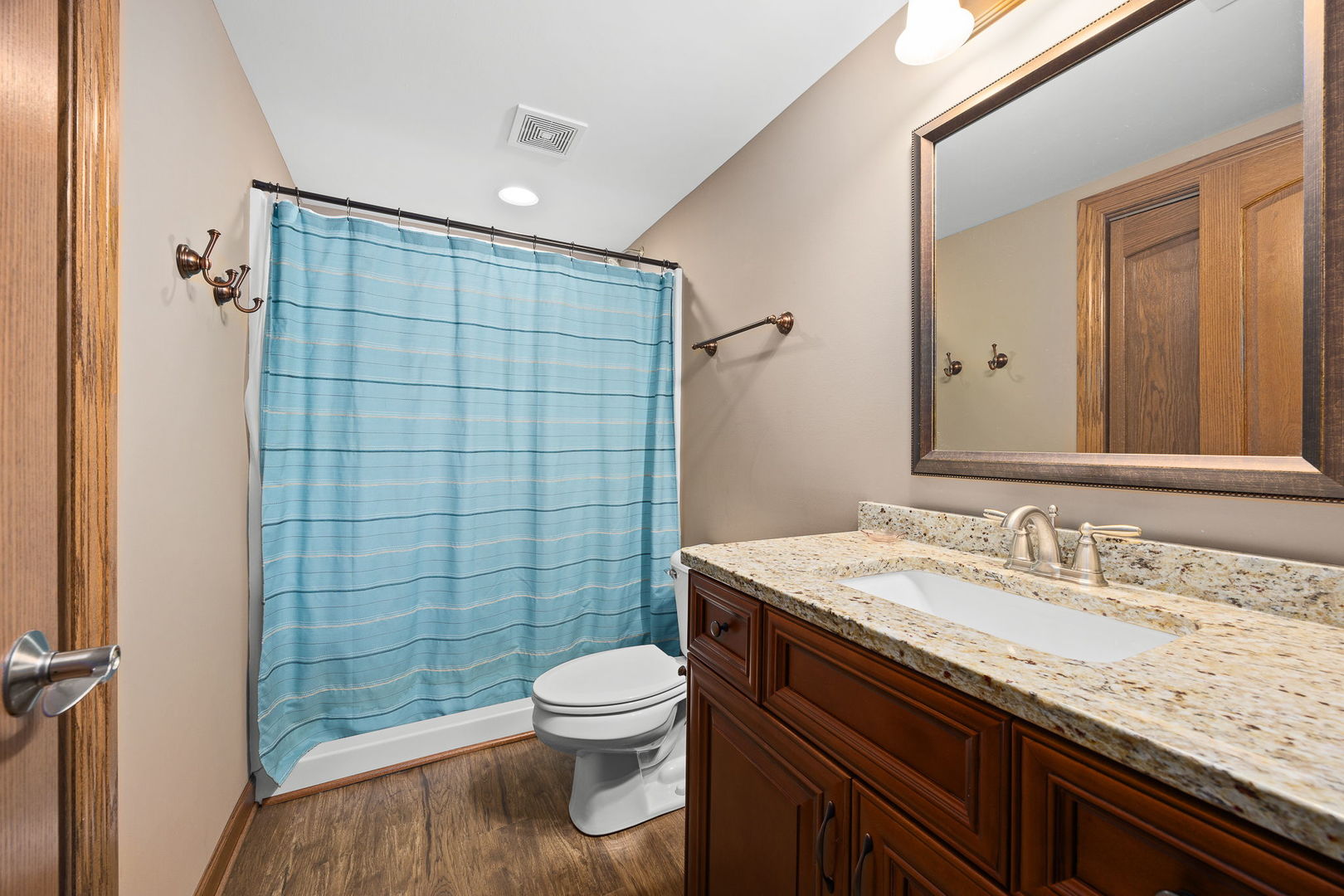 311 West Frontier Drive Minooka, IL 60447 - Photo 32 of 44 a bathroom with a granite countertop sink toilet and shower