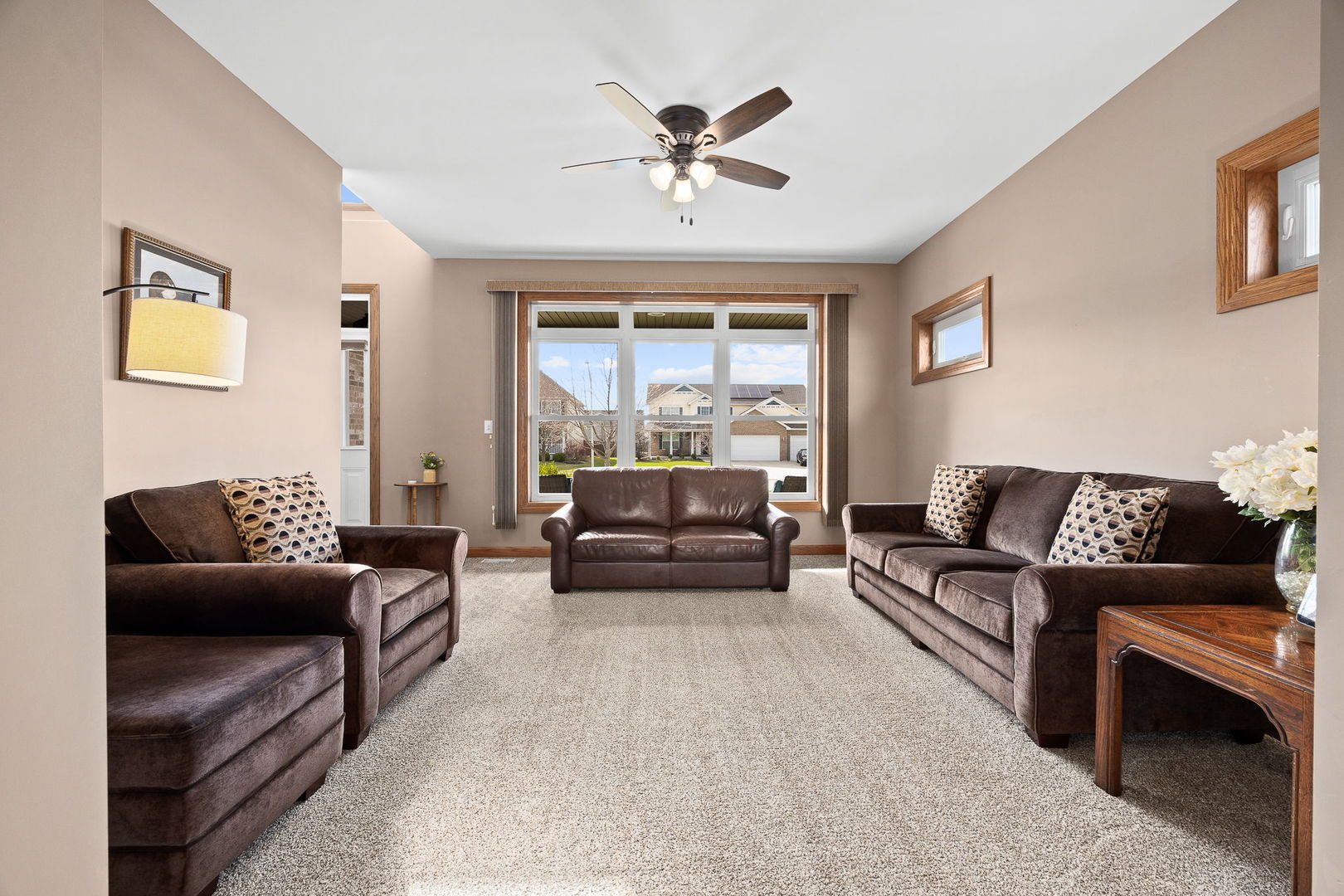 311 West Frontier Drive Minooka, IL 60447 - Photo 6 of 44 a living room with furniture and a large window