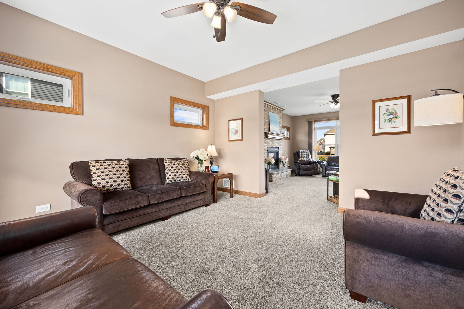 311 West Frontier Drive Minooka, IL 60447 - Photo 7 of 44 a living room with furniture and a chandelier