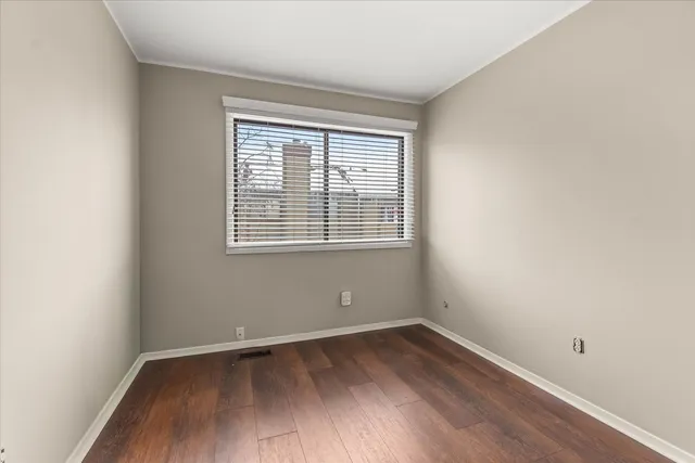 wooden floor and window in an empty room