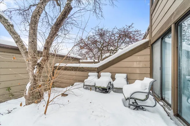 a view of patio with chair and tables