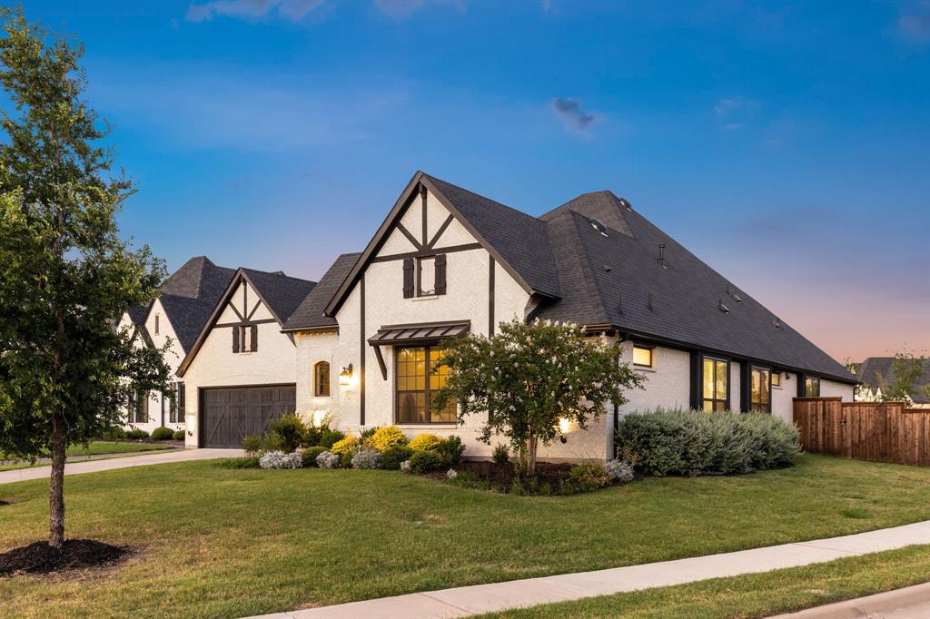 3508 Ruffian Court Celina, TX 75009 - Photo 1 of 38 a front view of a house with a garden