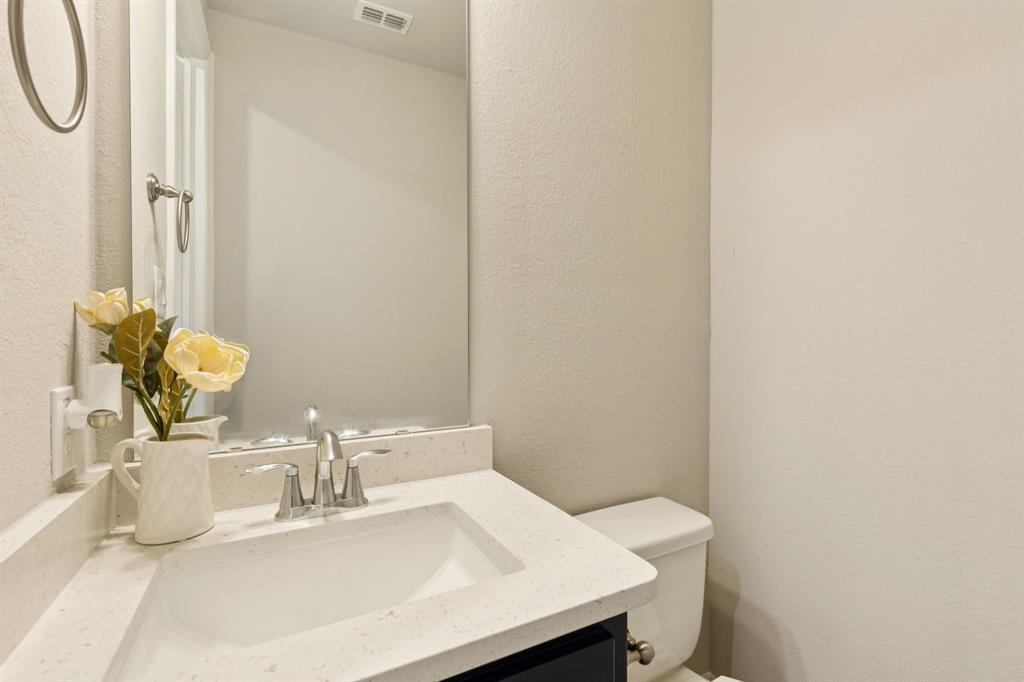 3508 Ruffian Court Celina, TX 75009 - Photo 21 of 38 a bathroom with a sink and a mirror