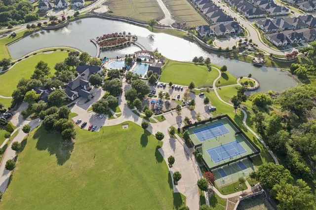 an aerial view of a house with a lake view