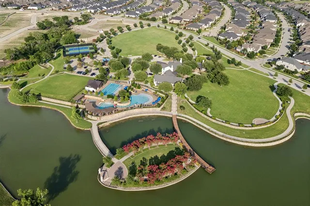 an aerial view of a house with a swimming pool