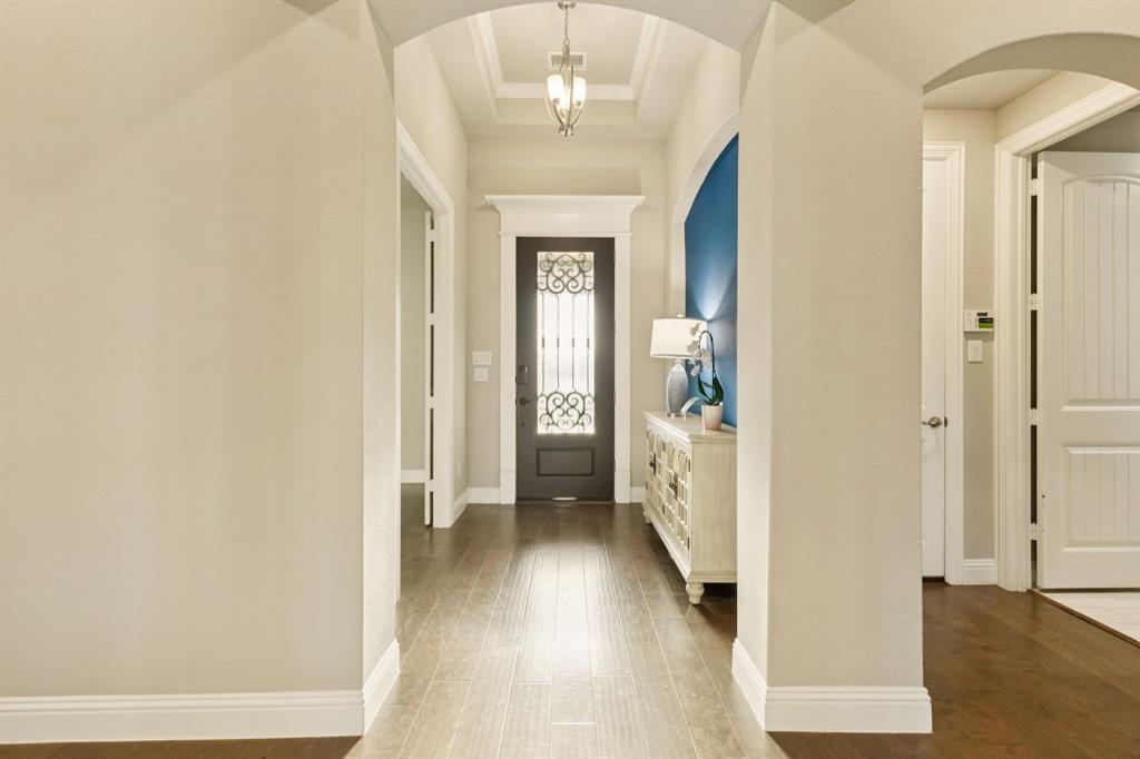 3508 Ruffian Court Celina, TX 75009 - Photo 38 of 38 a view of a hallway with wooden floor and staircase