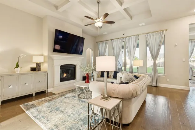 a living room with furniture fireplace and a flat screen tv