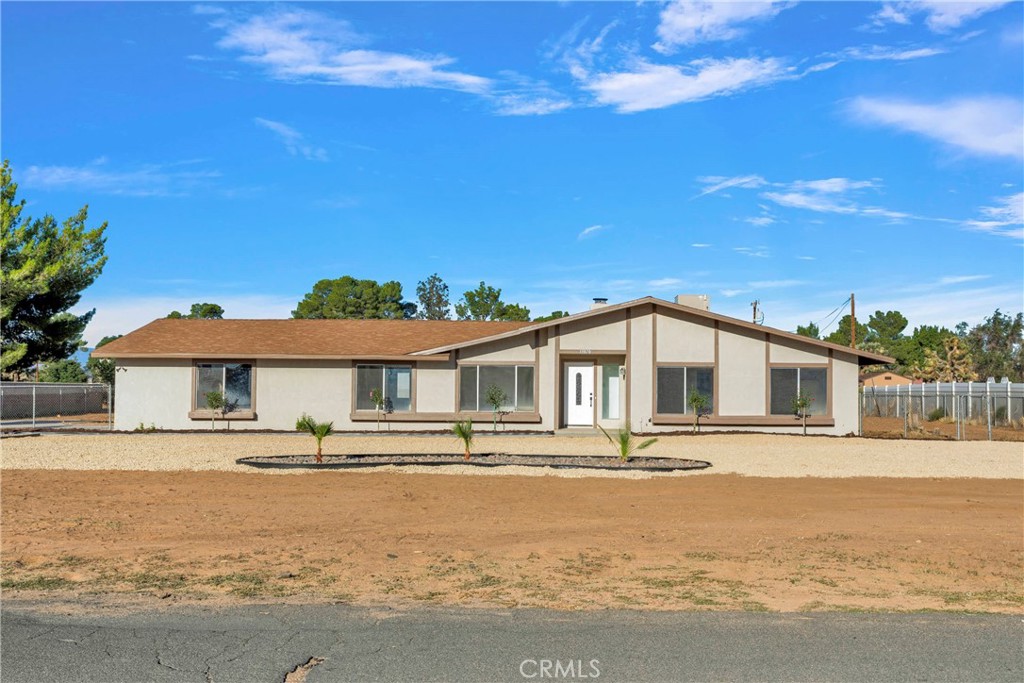 13870 Hopi Road Apple Valley, CA 92307 - Photo 1 of 1 a front view of a house with a ocean view