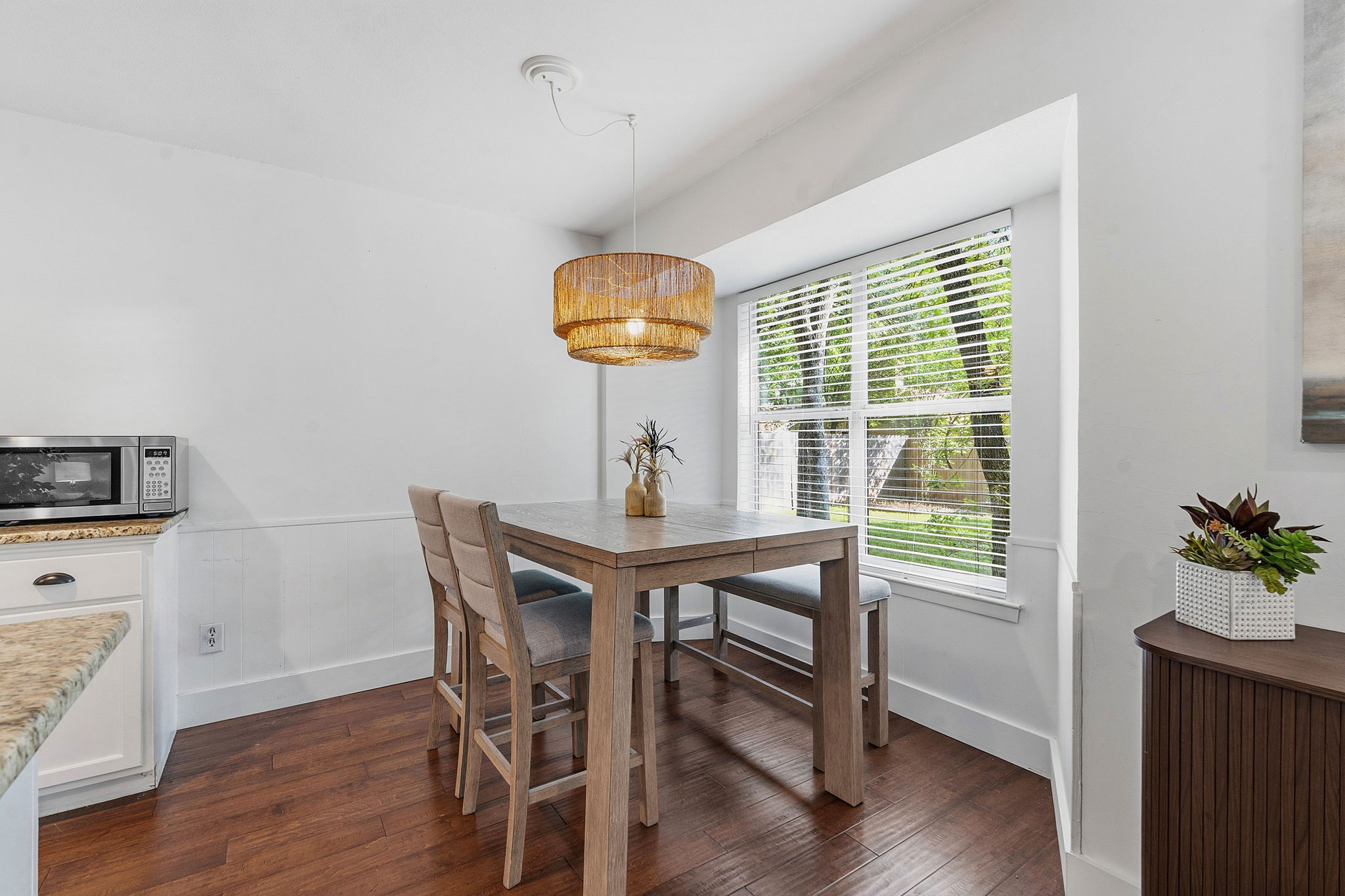 4705 Fieldstone Drive Austin, TX 78735 - Photo 13 of 34 a view of a dining room with furniture window and wooden floor