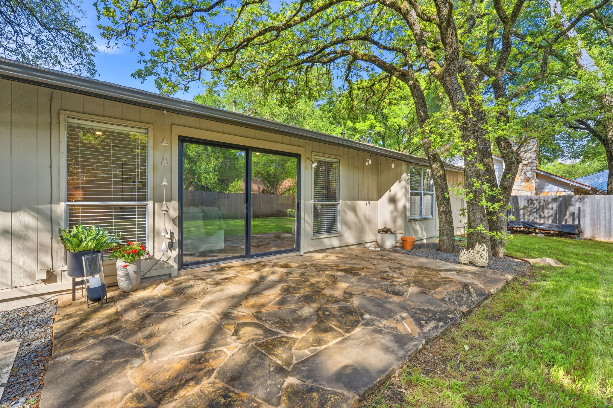 4705 Fieldstone Drive Austin, TX 78735 - Photo 22 of 34 a view of a house with a backyard and a large tree