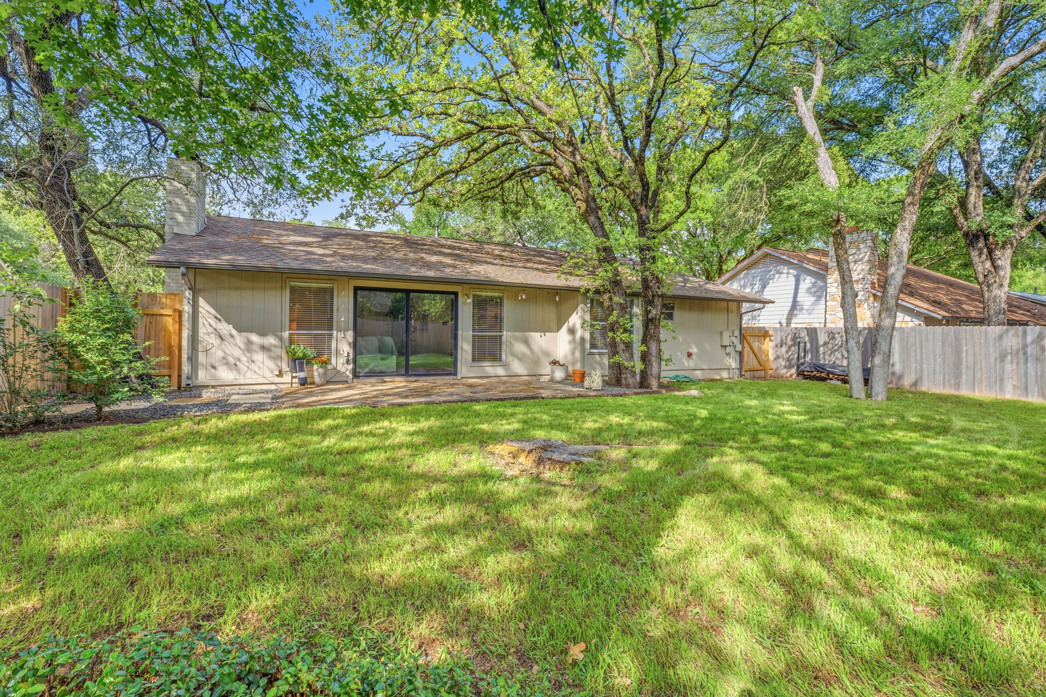 4705 Fieldstone Drive Austin, TX 78735 - Photo 23 of 34 a front view of house with yard and green space