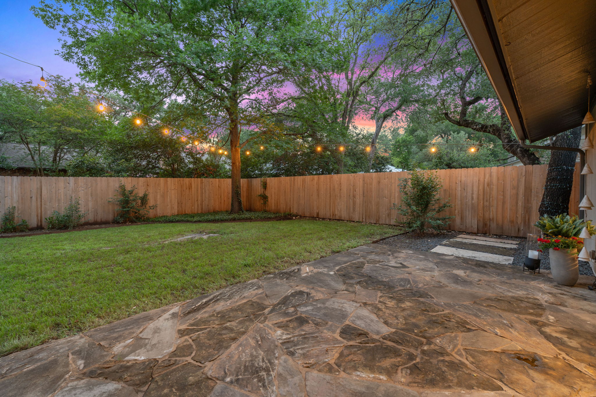 4705 Fieldstone Drive Austin, TX 78735 - Photo 27 of 34 a view of a backyard with large tree and wooden fence