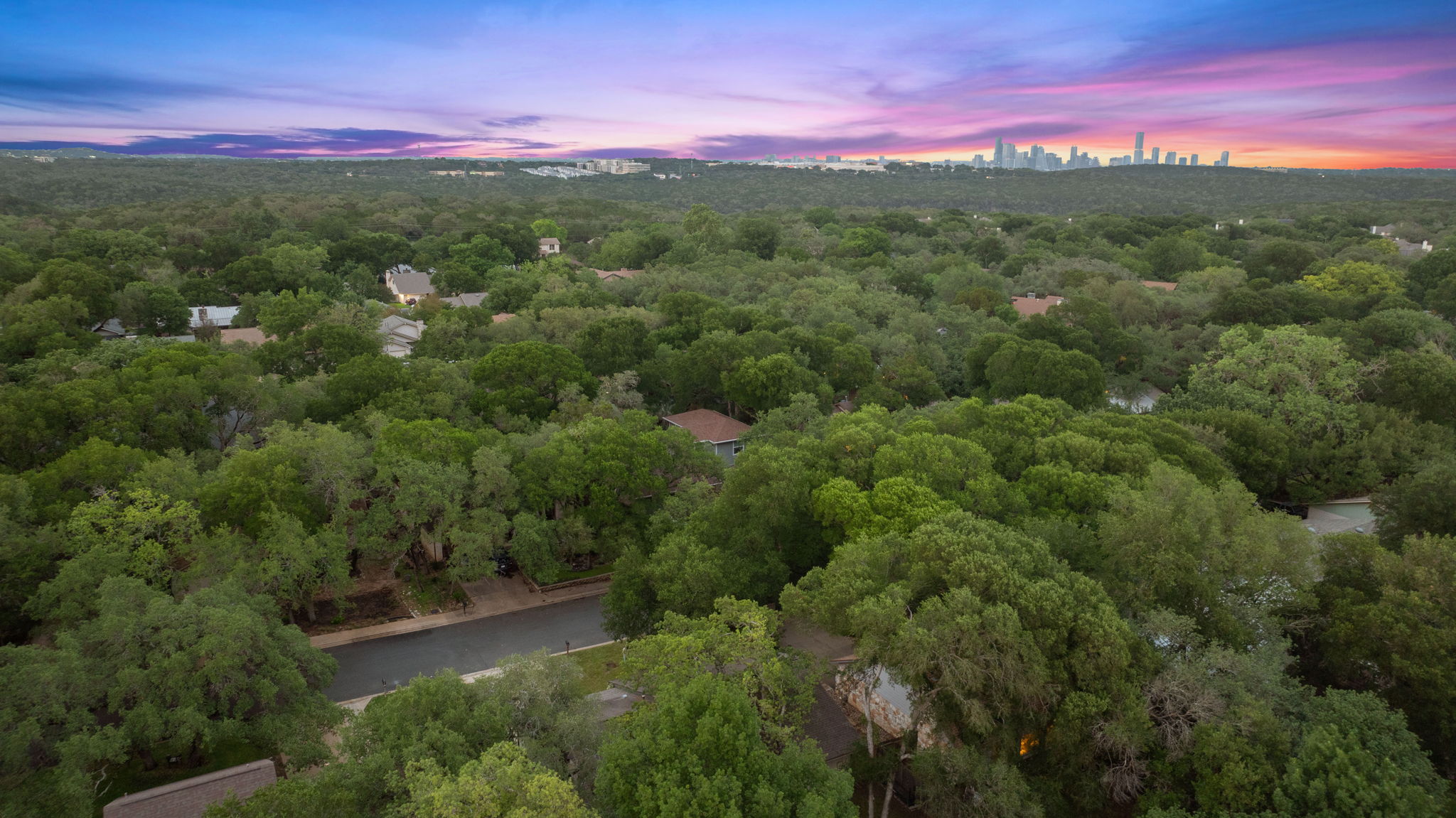 4705 Fieldstone Drive Austin, TX 78735 - Photo 30 of 34 a view of a city with lush green forest
