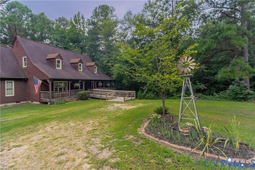 19321 River Road Chesterfield, VA 23838 - Photo 11 of 50 a view of a house with a backyard and a patio