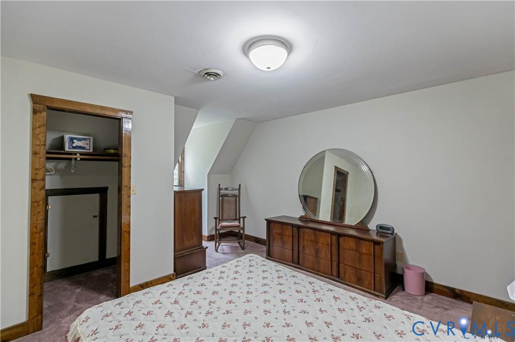 19321 River Road Chesterfield, VA 23838 - Photo 46 of 50 a bedroom with a bed and a view of bathroom