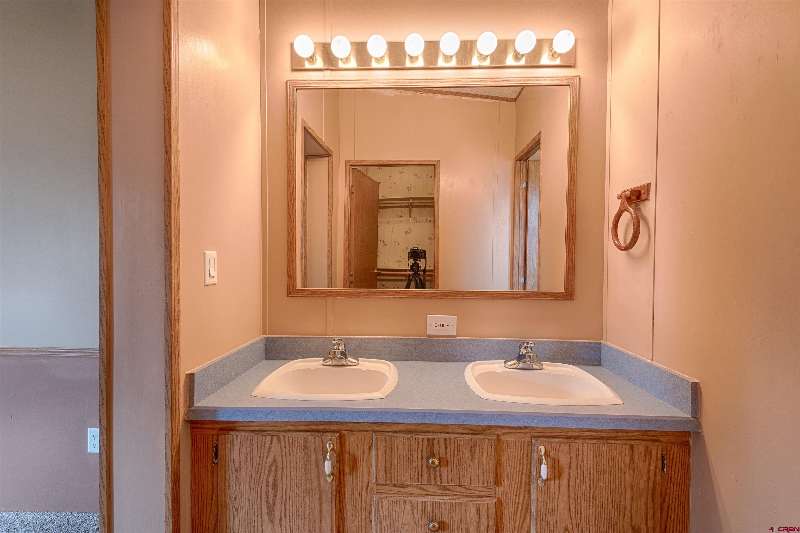 67135 N Road Montrose, CO 81401 - Photo 17 of 35 a bathroom with a sink and a mirror