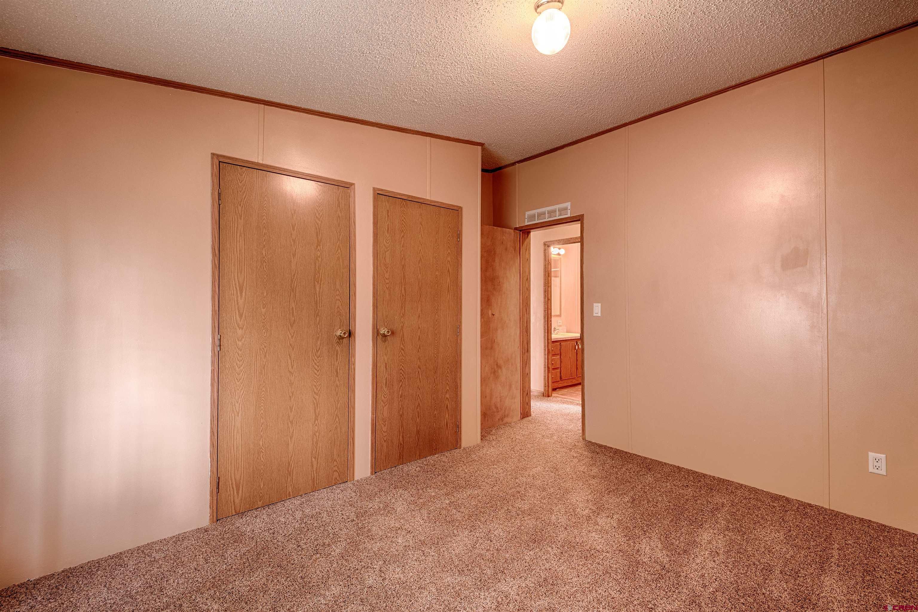 67135 N Road Montrose, CO 81401 - Photo 25 of 35 a view of an empty room and a window