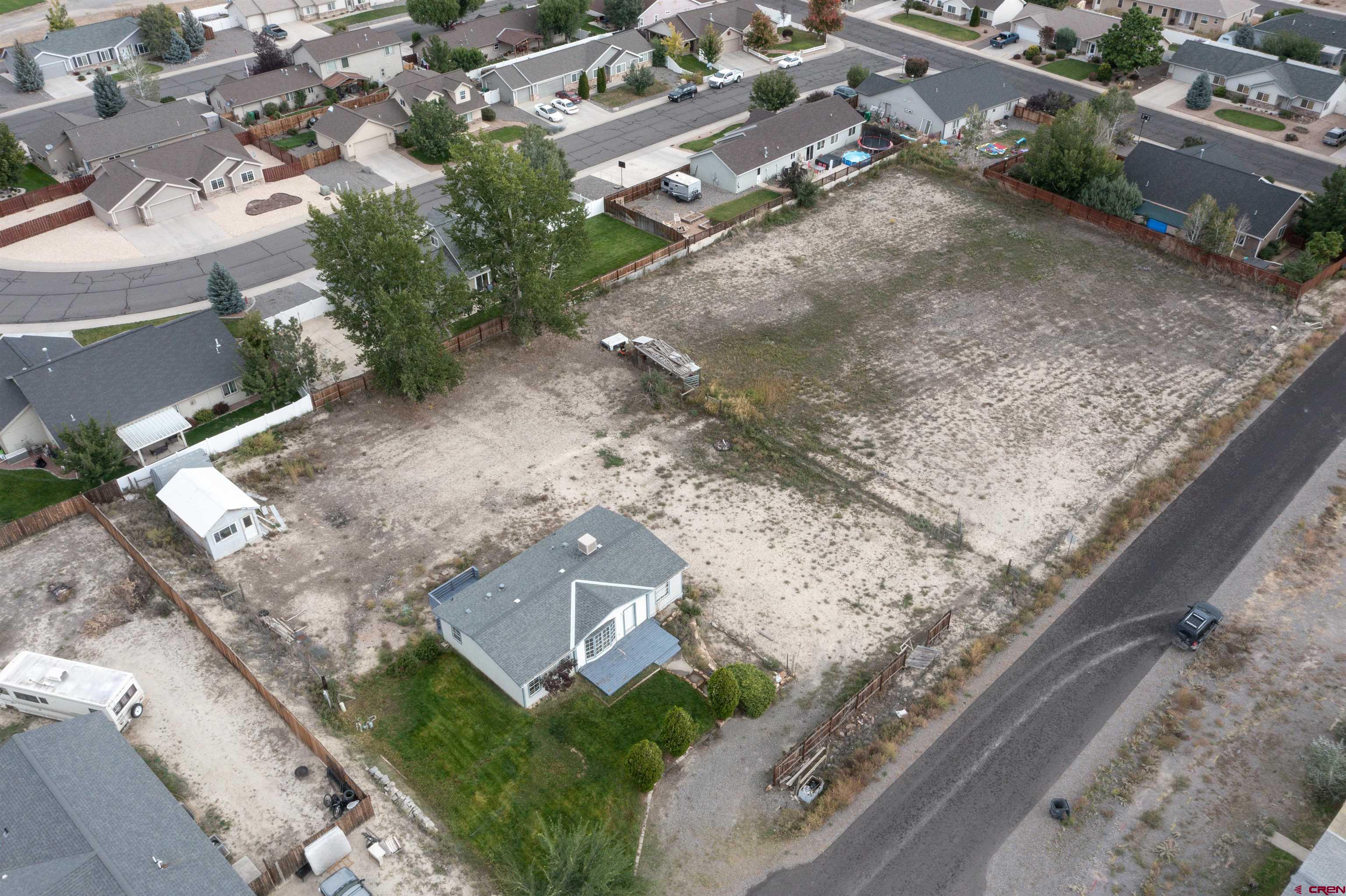 67135 N Road Montrose, CO 81401 - Photo 26 of 35 a view of a yard with wooden fence