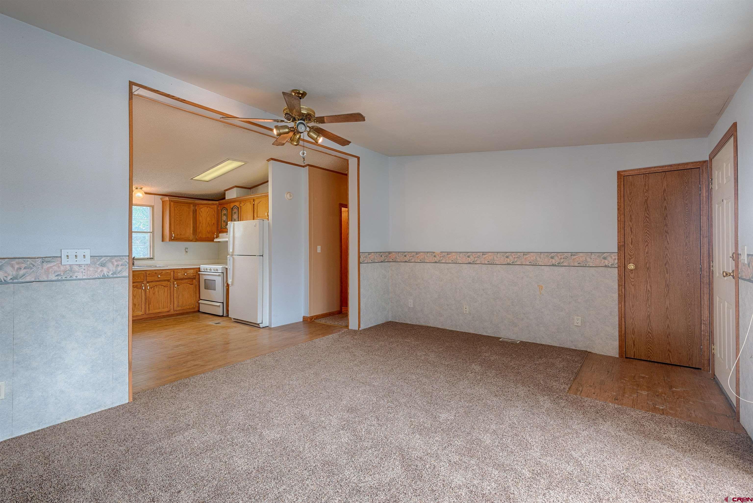 67135 N Road Montrose, CO 81401 - Photo 8 of 35 a view of a big room with closet and windows