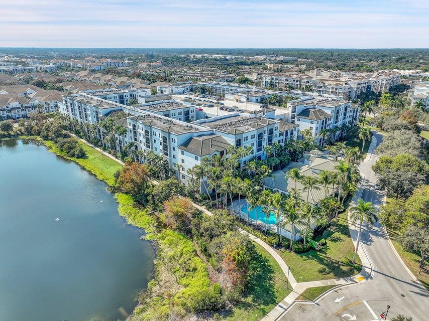 1660 Renaissance Commons Boulevard, Unit 2418 Boynton Beach, FL 33426 - Photo 17 of 18 an aerial view of a city with lake view