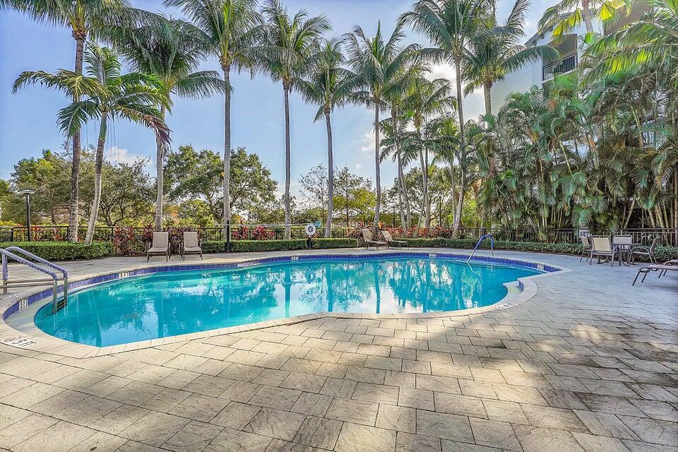 1660 Renaissance Commons Boulevard, Unit 2418 Boynton Beach, FL 33426 - Photo 18 of 18 a view of swimming pool with a yard