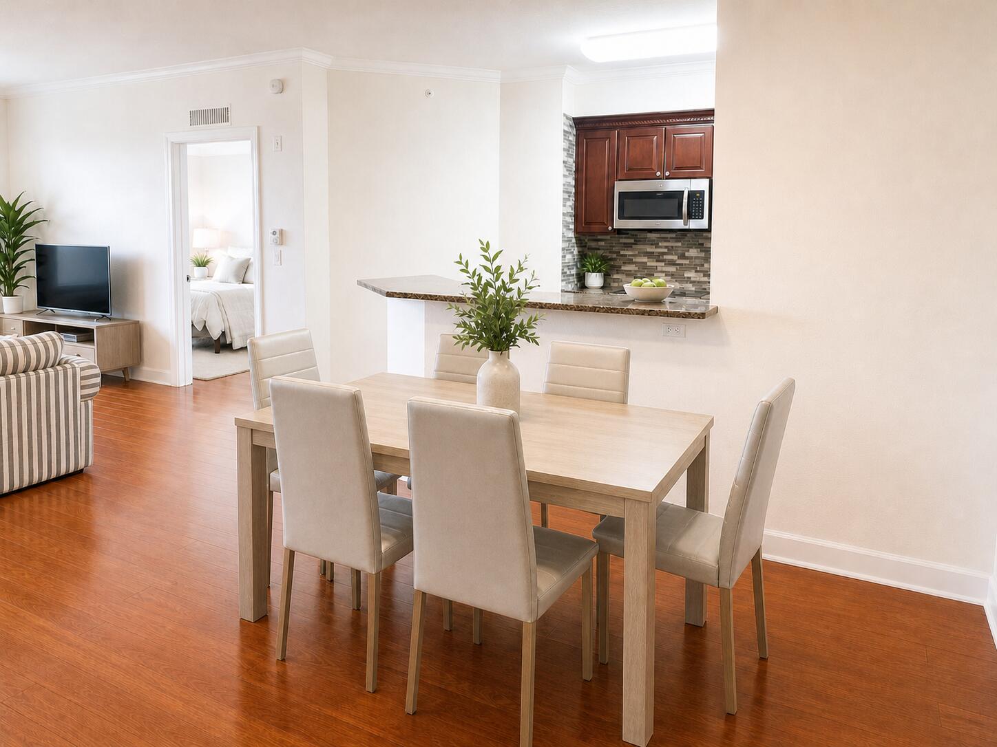 1660 Renaissance Commons Boulevard, Unit 2418 Boynton Beach, FL 33426 - Photo 9 of 18 a dining room with furniture and wooden floor