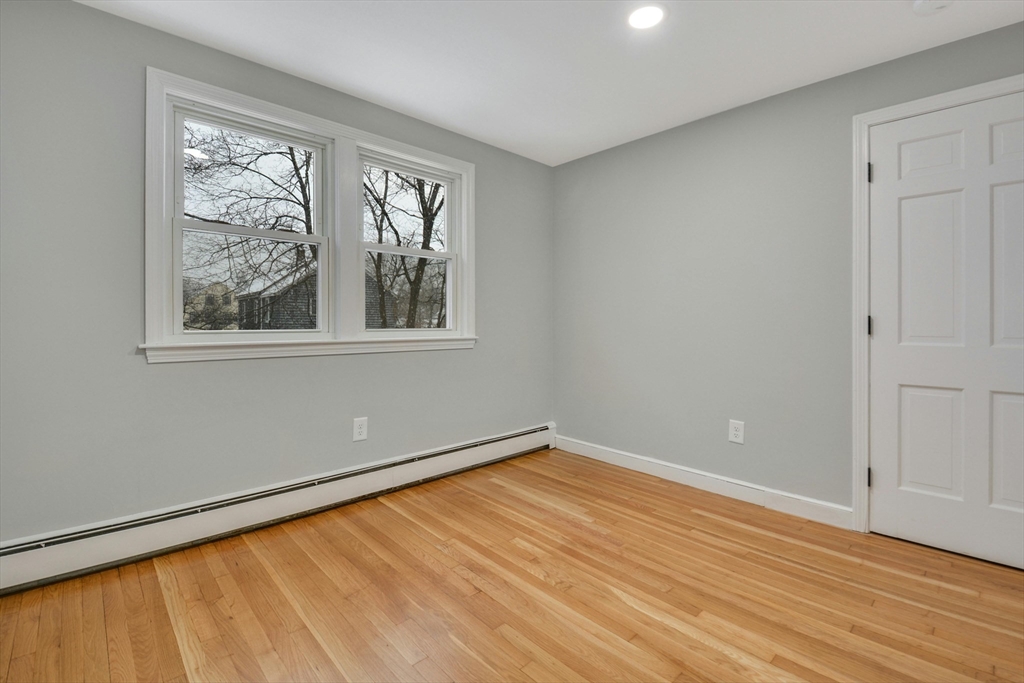 42 Riverside Avenue Concord, MA 01742 - Photo 11 of 21 a view of an empty room with wooden floor and a window
