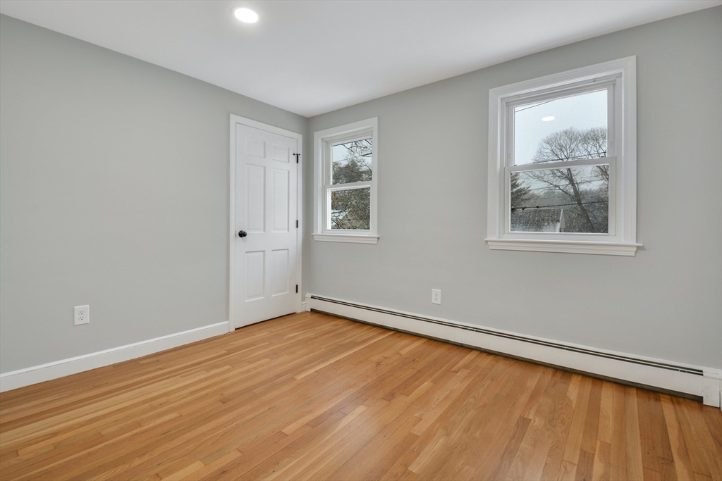 42 Riverside Avenue Concord, MA 01742 - Photo 12 of 21 a view of an empty room with wooden floor and a window