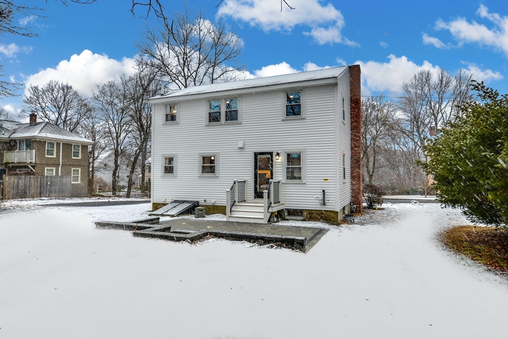 42 Riverside Avenue Concord, MA 01742 - Photo 19 of 21 a backyard of a house with table and chairs