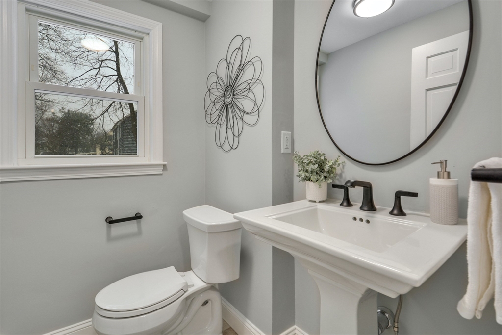 42 Riverside Avenue Concord, MA 01742 - Photo 8 of 21 a bathroom with a toilet a sink and a mirror