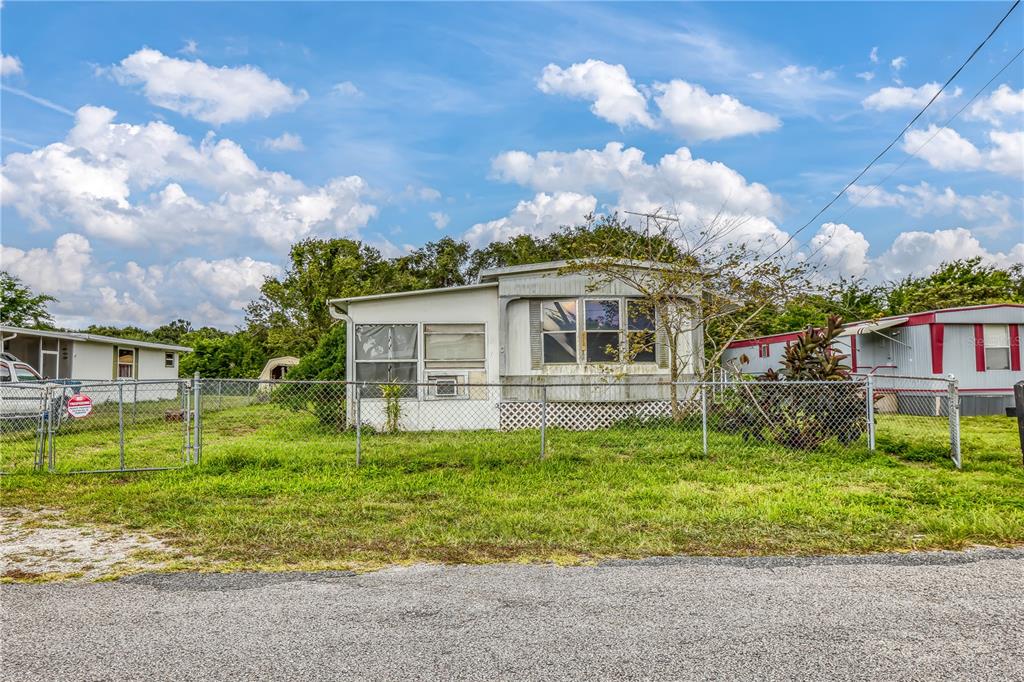 104 Douglas Street Edgewater, FL 32141 - Photo 1 of 1 a front view of a house with garden