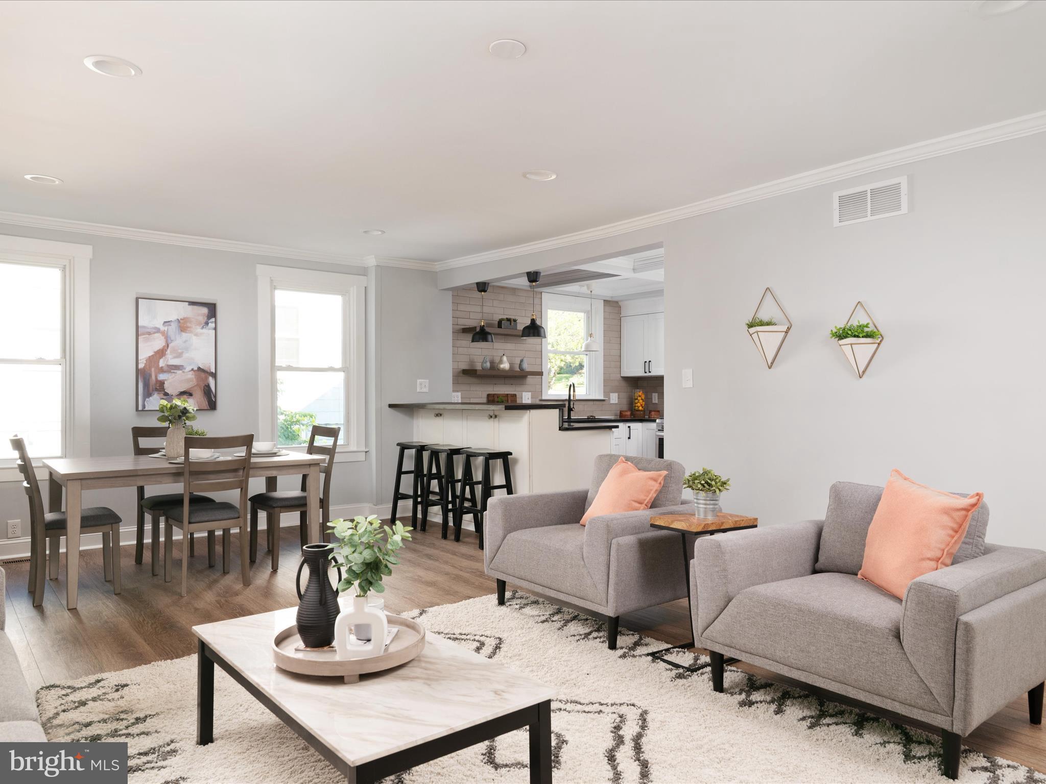 1119 Overbrook Road Baltimore, MD 21239 - Photo 20 of 72 a living room with furniture kitchen view and a window