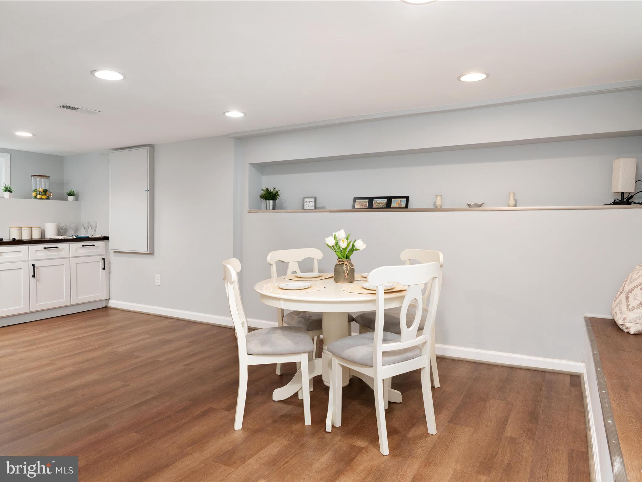 1119 Overbrook Road Baltimore, MD 21239 - Photo 24 of 72 a view of a dining room with furniture and wooden floor