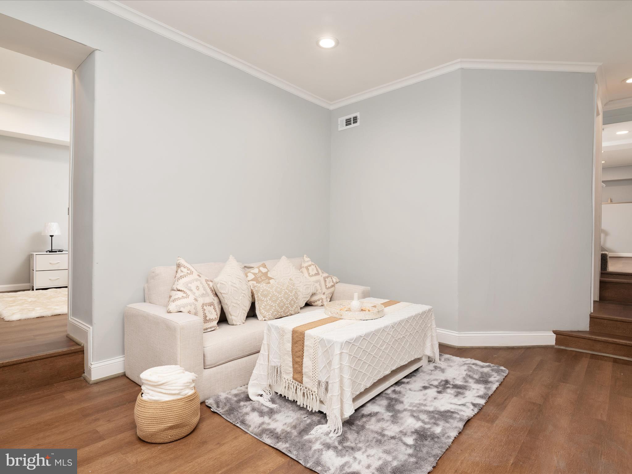 1119 Overbrook Road Baltimore, MD 21239 - Photo 30 of 72 a living room with furniture and a couch