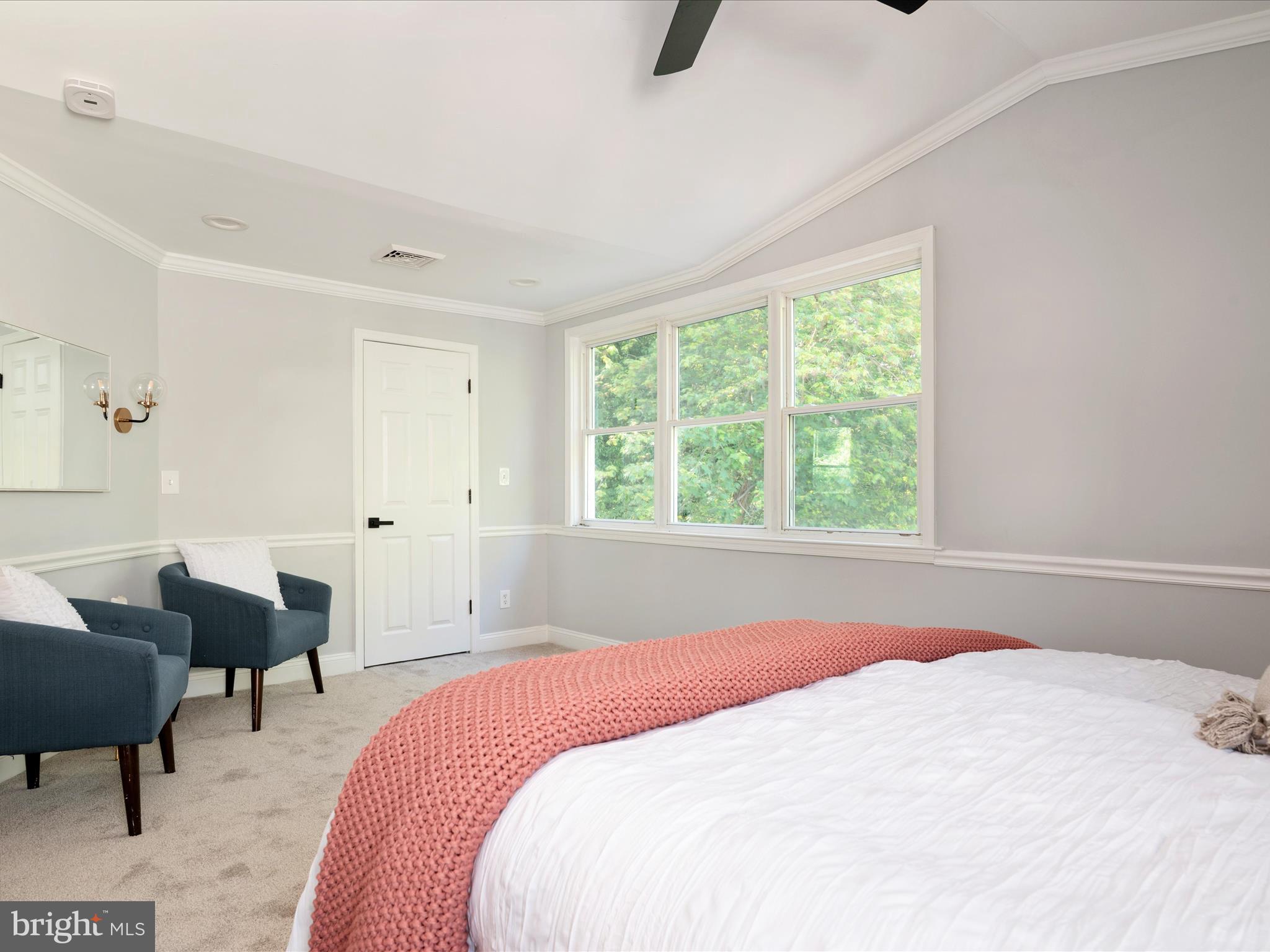 1119 Overbrook Road Baltimore, MD 21239 - Photo 33 of 72 a bedroom with a bed a table and chair