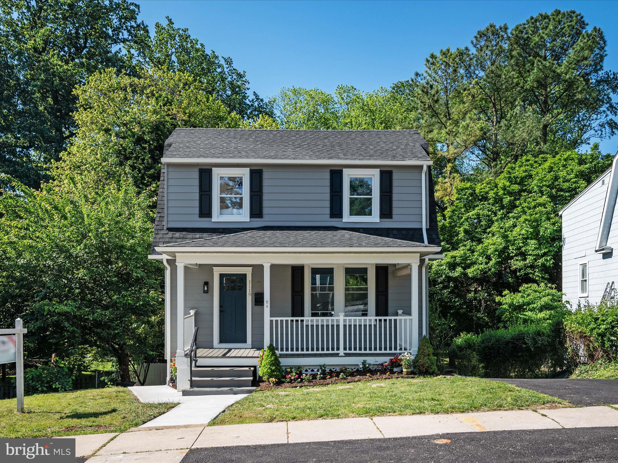 1119 Overbrook Road Baltimore, MD 21239 - Photo 59 of 72 a front view of a house with a yard