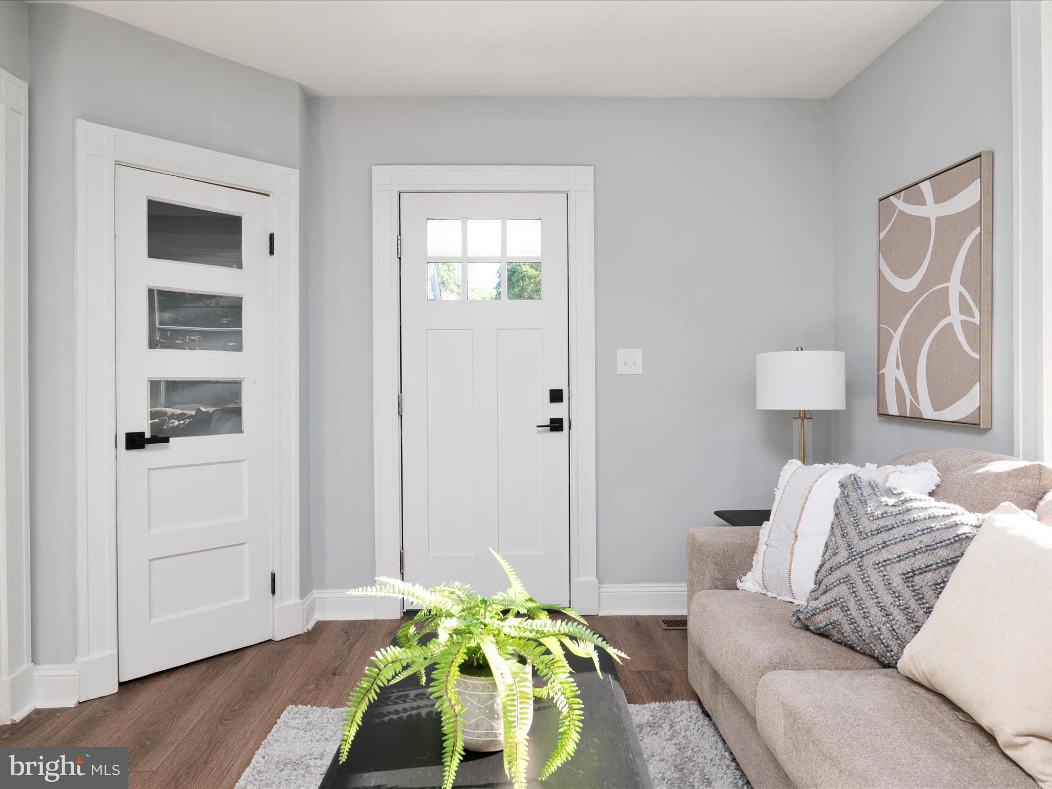 1119 Overbrook Road Baltimore, MD 21239 - Photo 8 of 72 a bedroom with a bed and a potted plant