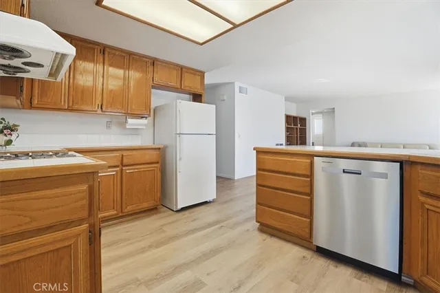a view of a room with wooden floor and cabinet