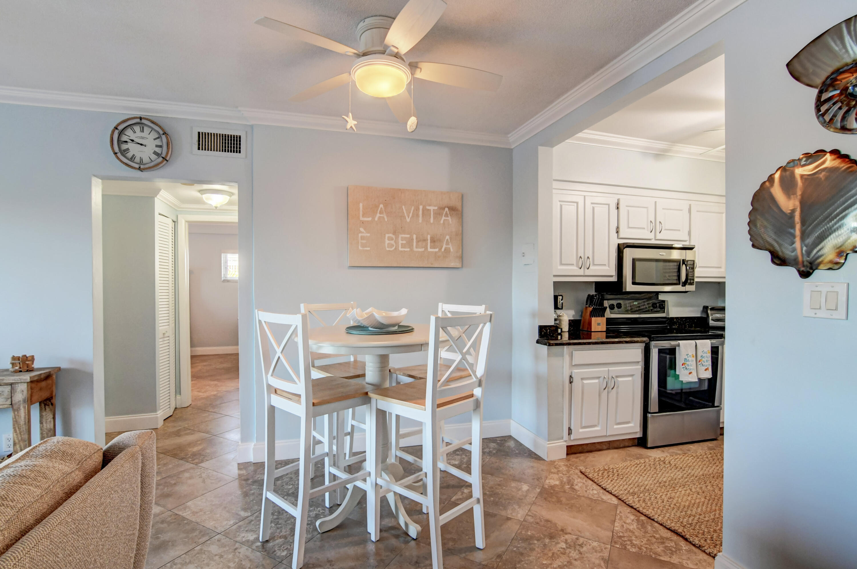 6520 North Ocean Boulevard, Unit 240 Ocean Ridge, FL 33435 - Photo 10 of 29 a dining room with furniture and window